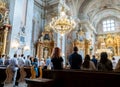 People at the church. Prayer in the Cathedral. Warsaw, Poland - July 27, 2023