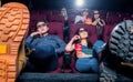 People in the cinema wearing 3d glasses