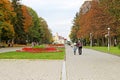 People in the city park with wide footpath in Chernihiv