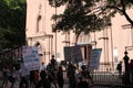 People on city street outside church in New York City USA