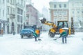 People cleaning city streets after snowstorm