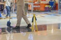 People cleaning floor in the mall