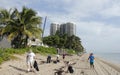 People Cleaning Up the Beach Royalty Free Stock Photo