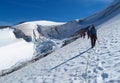 People climbers, climbing snow summit, rocky mountain peaks and glacier in Norway