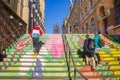 People climbing the colorful stairs on the market square in Halle