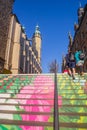 People climbing the colorful stairs on the market square in Halle