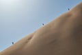 People climbing dune in the Namibia desert. Sossusvlei. Royalty Free Stock Photo