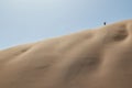 People climbing dune in the Namibia desert. Sossusvlei. Royalty Free Stock Photo