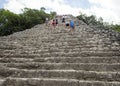 People climbing up an down the Nohoch Mul Pyramid in the Coba ruins