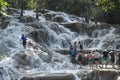 People climbing up Dunn`s River Falls, Jamaica