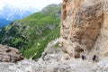 People climbing the Via Ferrata Severino Casara in Sexten Dolomites with mountain panorama, South Tyrol