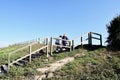 People climbing the wooden stairs on the coast of La CoruÃÂ±a, Galicia. Spain. October 9, 2019