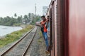 People clinging to driving train in Sri Lanka Royalty Free Stock Photo