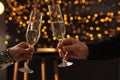 People clinking glasses of champagne indoors, closeup Royalty Free Stock Photo