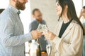 People clinking glasses with wine or champagne. Happy cheerful friends celebrate holidays, meeting. Close up shot of Royalty Free Stock Photo