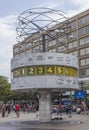 People close to the World Clock (Weltzeituhr), a landmark in Alexanderplatz Square, Berlin, Germany. Royalty Free Stock Photo