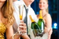 People in club or bar drinking champagne Royalty Free Stock Photo