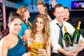 People in club or bar drinking champagne Royalty Free Stock Photo