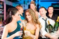 People in club or bar drinking champagne Royalty Free Stock Photo