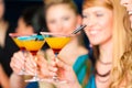 People in club or bar drinking cocktails Royalty Free Stock Photo