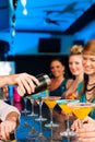 People in club or bar drinking cocktails Royalty Free Stock Photo