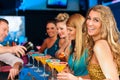 People in club or bar drinking cocktails Royalty Free Stock Photo