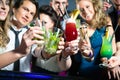 People in club or bar drinking cocktails Royalty Free Stock Photo