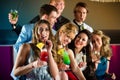 People in club or bar drinking cocktails Royalty Free Stock Photo