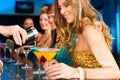 People in club or bar drinking cocktails Royalty Free Stock Photo