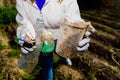 People collaborating in the cleaning of plastic garbage from the environment as abandoned bottles