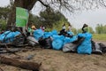 Kaliningrad, Russia - May 18, 2019: Ecological event at baltic sea coast, people cleaning shoreline from garbage