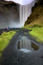 People in colourful jackets looking at Waterfall SkÃÂ³gafoss Royalty Free Stock Photo