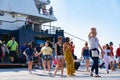 People on and coming and going from Greek Island ferry at wharf at Skiathos Royalty Free Stock Photo