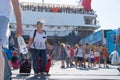 People on and coming and going from Greek Island ferry at wharf at Skiathos Royalty Free Stock Photo