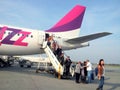 People coming out from a Wizzair plane