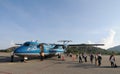 People coming to the aircraft at Condao airport in Vungtau, Vietnam Royalty Free Stock Photo