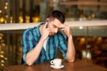 Man with coffee calling smartphone at restaurant Royalty Free Stock Photo