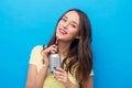 Young woman or teenage girl drinking soda from can Royalty Free Stock Photo