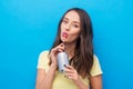 Young woman or teenage girl drinking soda from can Royalty Free Stock Photo