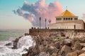 Cadiz. People contemplating the waves breaking against the rocks from a bastion on the La Caleta promenade, with a dramatic sky Royalty Free Stock Photo