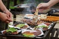 People cooking barbecue outdoor. Summer party with grilled food Royalty Free Stock Photo