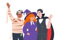 People in costumes for Halloween night, vampire, witch and mummy