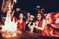 People in Costumes Looking at Flaming Cocktail Royalty Free Stock Photo