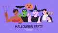 People in costumes of witch, devil, vampire and frankenstein monster on halloween party with balloons