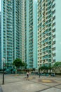 People on court of high-rise apartment building, residential building complex in Hong Kong Royalty Free Stock Photo