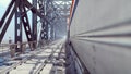 People cross a railway bridge on a cloudy summer morning when a passenger train passes by. 3D Rendering