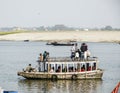 People cross the river Ganges on a ferry Royalty Free Stock Photo