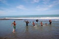 People cross river at sea coast