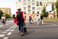 People cross the road on the pedestrian crossing