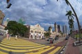 People cross street in front of the Sultan Abdul Samad building at the Independence square in Kuala Lumpur, Malaysia.